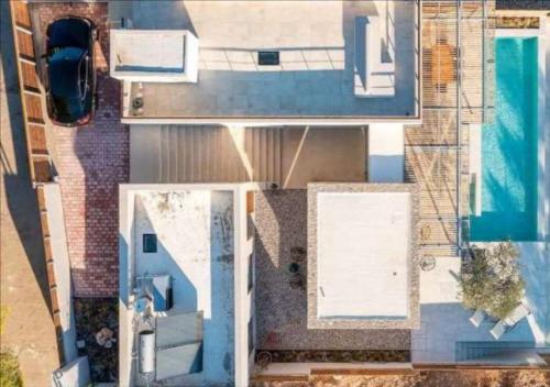 an overhead view of a house and a swimming pool at Villa Alliopi ein Blick für die Sinne in Kranidi