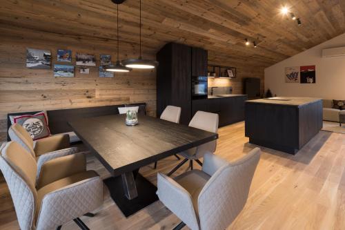 a dining room with a table and chairs at Haus Sonnblick Chalet in Reith im Alpbachtal