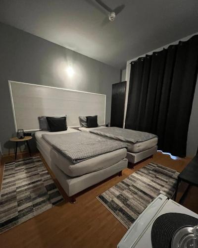 a bedroom with two beds in a room at PENSIUNEA UNO in Timişoara