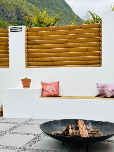 a fire pit in the middle of a patio at Villa Couleur Nature in Salazie