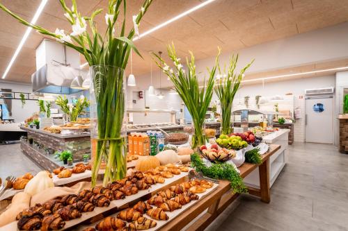a buffet with many different types of food on display at Merom Golan Resort in Merom Golan
