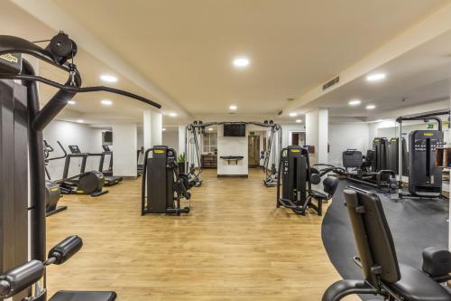 a gym with lots of treadmills and machines at Hacienda Resort in Cabo San Lucas