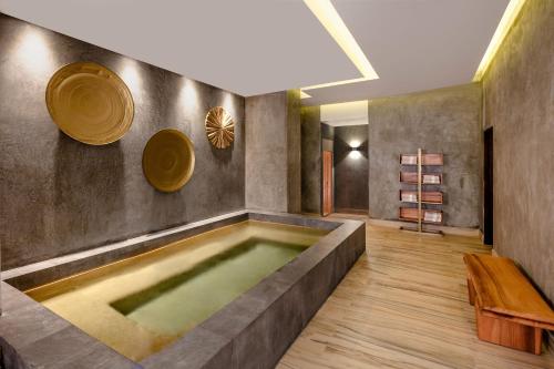 a bathroom with a large tub in the middle of the room at Hacienda Resort in Cabo San Lucas