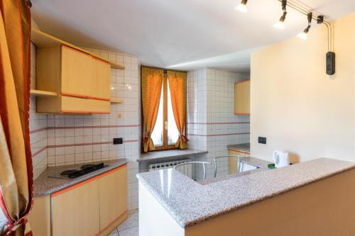 a kitchen with a counter top in a room at Locanda Piemonte da Sciolla in Domodossola