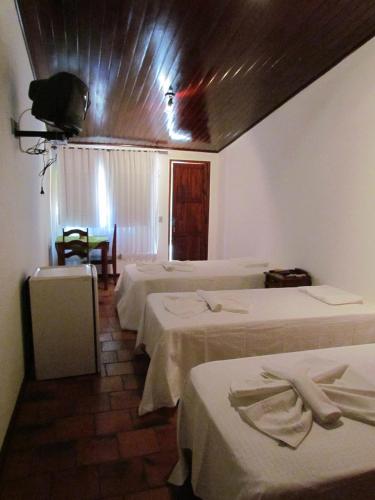 Ένα ή περισσότερα κρεβάτια σε δωμάτιο στο Hotel dos Bretões