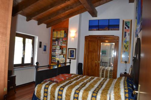 a bedroom with a bed in a room at Casa di Montagna in San Colombano, Vista, Relax , Wifi in San Colombano