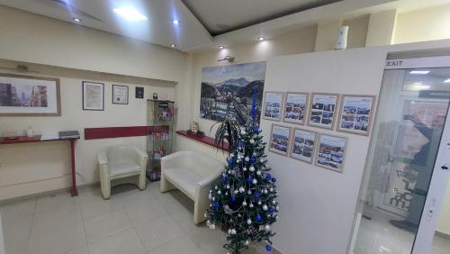 a room with a christmas tree in a waiting room at Hotel Villa Panorama in Belgrade