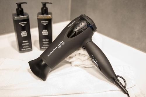 a hair dryer sitting on top of a counter at SCOTTY & PAUL Hotel Deggendorf in Deggendorf