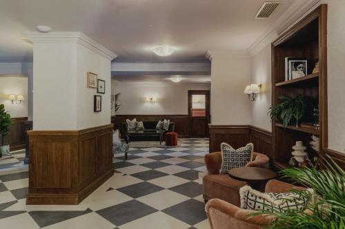 a lobby with couches and chairs in a building at The Queens Hotel in Portsmouth