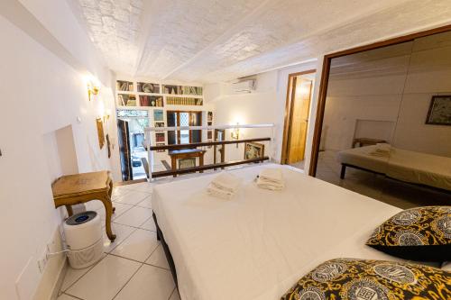 a bedroom with two beds in a room at Trastevere Apartment in Rome