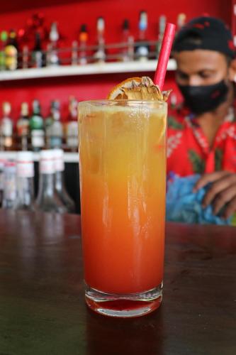 a drink with a red straw sitting on a table at W15 Weligama in Weligama
