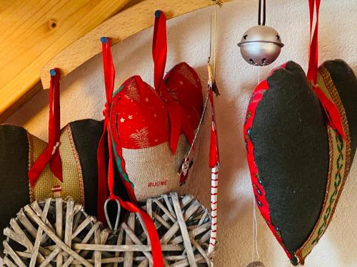 a group of shoes hanging on a wall at A casa di Gio' in Bosco Gurin