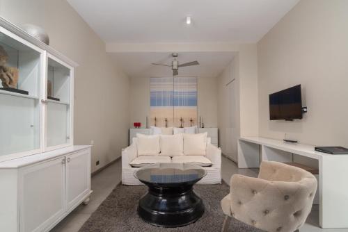 a living room with a couch and a table and chairs at W15 Weligama in Weligama