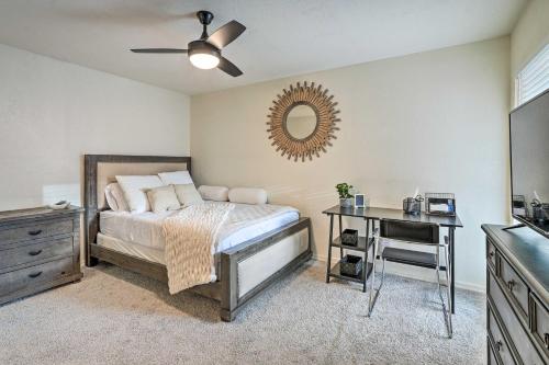 a bedroom with a bed and a mirror and a desk at Pet-Friendly Litchfield Park Vacation Rental! in Litchfield Park