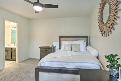 a bedroom with a bed and a mirror on the wall at Patio and Workspace Litchfield Park Vacation Rental in Litchfield Park