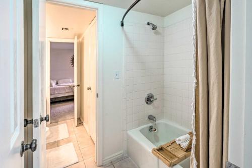 a bathroom with a white tub and a shower stall at Patio and Workspace Litchfield Park Vacation Rental in Litchfield Park