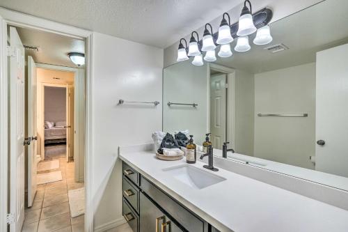 a bathroom with a sink and a mirror at Pet-Friendly Litchfield Park Vacation Rental! in Litchfield Park