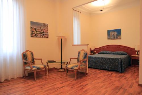 Postel nebo postele na pokoji v ubytování Hotel Palladio