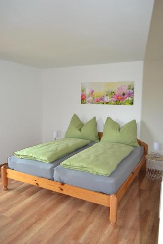 Una cama o camas en una habitación de Biohof Auinger, der Tiererlebnishof