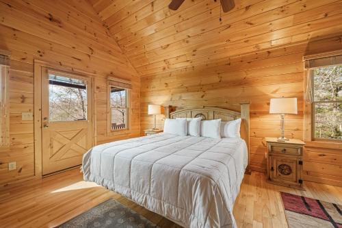 a bedroom with a bed in a wooden room at Casa nel Bosco in Blue Ridge
