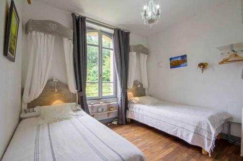 Postel nebo postele na pokoji v ubytování Villa Tranquillité