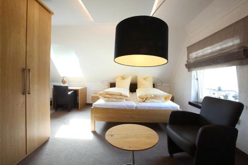 Cama o camas de una habitación en Weingut Matthias Dostert / Culinarium