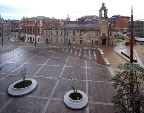 an empty parking lot in front of a building at Holiday Inn Sunderland - City Centre by IHG in Sunderland