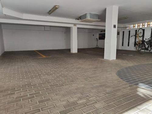 an empty parking garage with a bike parked in it at BYPILLOW Villa Lorena Adults Recommended in Málaga