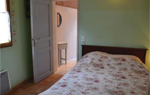 a bedroom with a bed and an open door at Gites Des Blanchiries in Aubin-Saint-Vaast