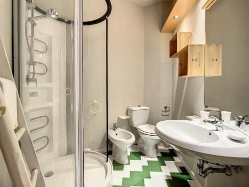 a bathroom with a toilet and a sink and a shower at Residence il Pino in Marina di Castagneto Carducci