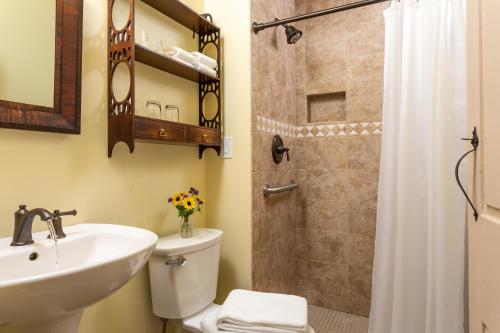 a bathroom with a sink and a toilet and a shower at The Grafton Inn in Grafton