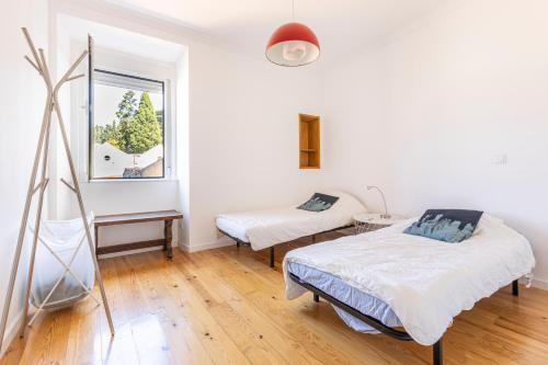 Postel nebo postele na pokoji v ubytování Comfy 3 Bedroom Apartment Campo de Ourique
