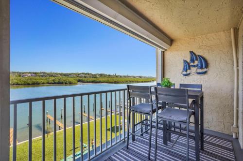 a balcony with two chairs and a view of the water at Bayshore Yacht & Tennis 409 - Premier in Clearwater Beach