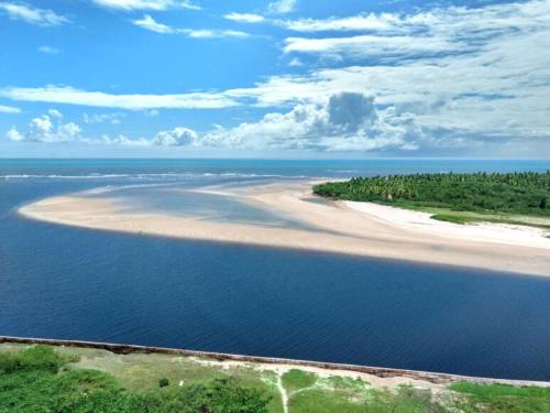 an aerial view of a beach in the ocean at FLAT BEIRA MAR BARRA DE JANGADA RECIFE ANDAR ALTO in Recife