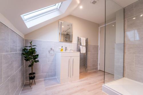 a bathroom with a shower and a sink at Stylish maisonette in town centre close to beach in Great Yarmouth