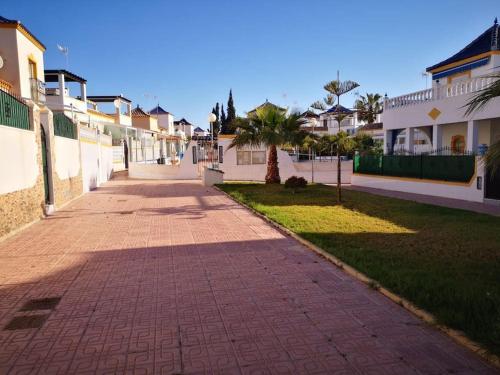 a brick walkway in front of some houses at Bungalow con Vistas al Mar in Torrevieja