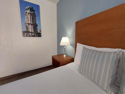 Een bed of bedden in een kamer bij Posada del Ángel