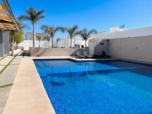 a swimming pool with blue water in a house at Casa SOL #222, para 6 personas in La Paz