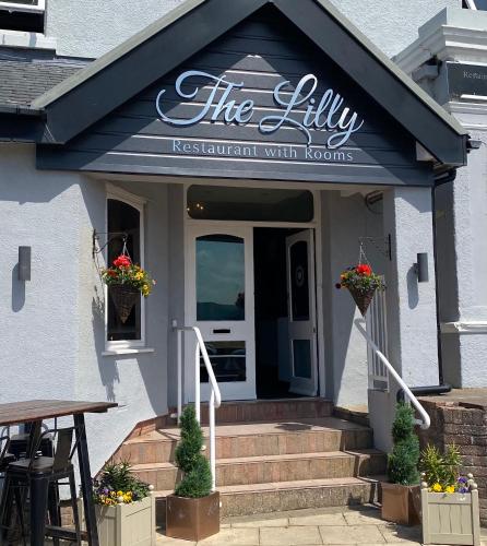 a restaurant with the lily restaurant with rooms at The Lilly Restaurant With Rooms in Llandudno
