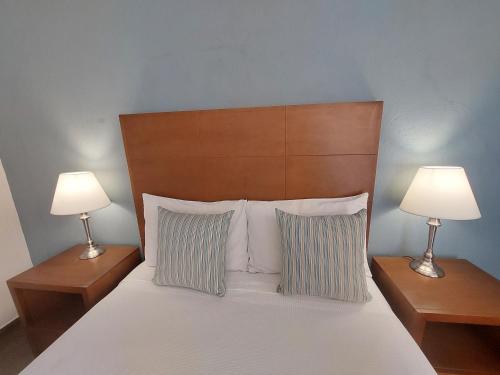 Een bed of bedden in een kamer bij Posada del Ángel