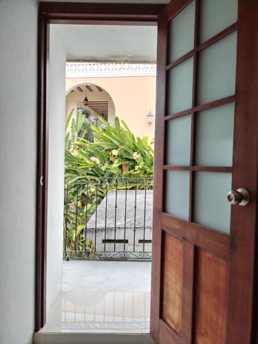 an open door with a view of a balcony at Casa San Roque Valladolid in Valladolid
