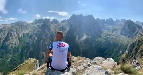 a man sitting on top of a mountain at PROKLETIJE eko katun Vusanje in Gusinje
