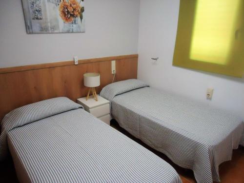 Postel nebo postele na pokoji v ubytování Peniscola Residencial Fase VI