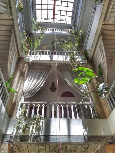 an overhead view of a building with potted plants at Les Terrasses d'Essaouira in Essaouira