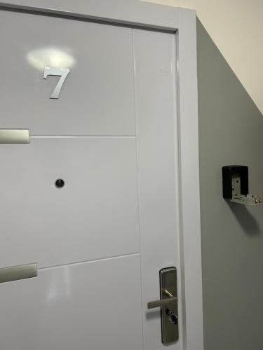 a door with a number seven on it in a room at Apartmani "Stari Grad - Samobor" in Samobor