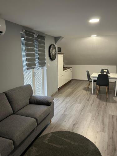 a living room with a couch and a table at Apartmani "Stari Grad - Samobor" in Samobor