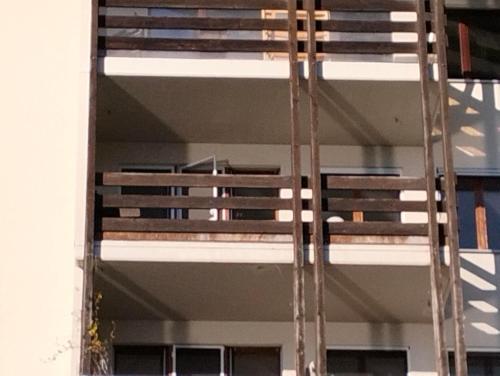 a building with a ladder on the side of it at Camenzind in Gersau