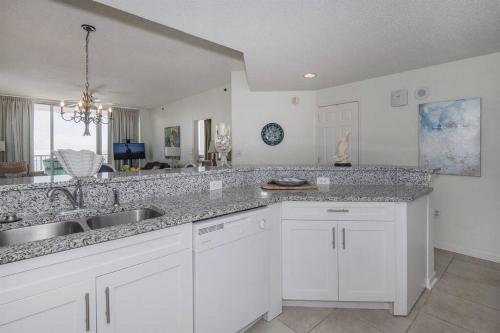 a kitchen with a sink and a counter top at Beach Club C1001 Amazing Corner Unit in Gulf Shores
