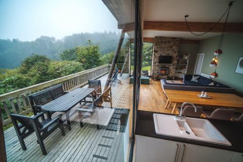 a balcony with a table and chairs and a sink at Yorkshire Dales Lodge 15 by Together Travel - 3-Bed Premium Ensuite in Richmond
