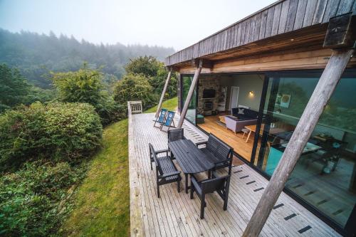 a porch of a house with chairs on it at Yorkshire Dales Lodge 15 by Together Travel - 3-Bed Premium Ensuite in Richmond